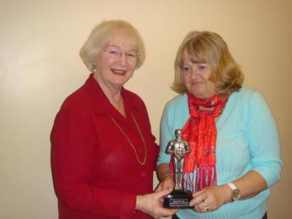 2009 Parish Clerk Lydia Knott presents Pam McMorran website Editor with the Oscar awarded by Leicestershire Villages